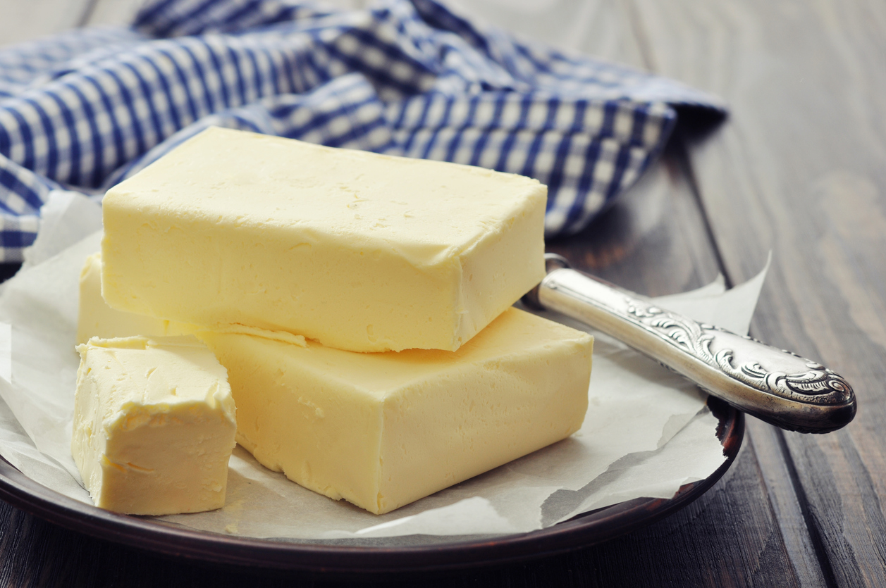 image shows butter on a plate with a knife