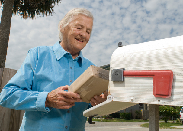 Senior citizen receives package in mail