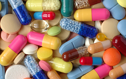 Many different pills (prescription medications).