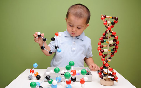 A child playing in the early development game about DNA.